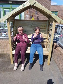 Service users sitting on a bench