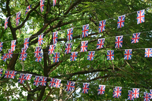 Photo of Union Jack bunting over trees